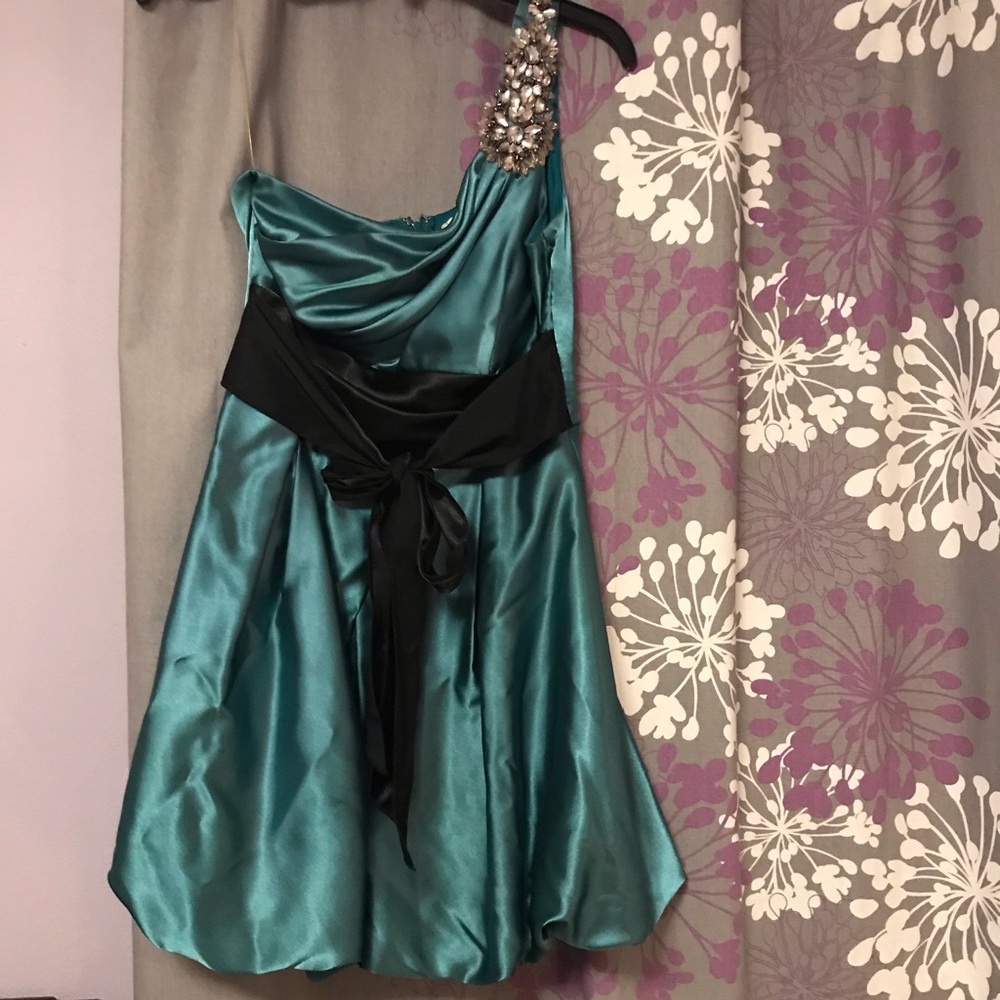 Formal dress with jeweled one strap.  Worn 1x